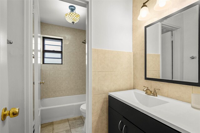 505 Central Ave Unit 609, White Plains, NY 10606 - full bathroom featuring vanity, tile walls, shower / bath combination, and tile patterned floors