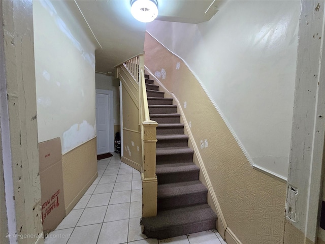 7622 60th Ln, Glendale, NY 11385 - stairs with tile patterned floors and baseboards