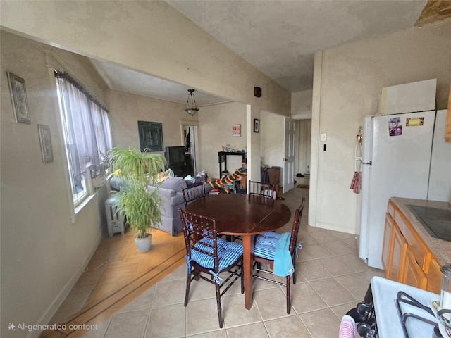 7622 60th Ln, Glendale, NY 11385 - dining room with light tile patterned floors and baseboards