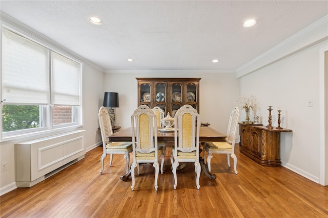 1390 Broadway Unit 118, Hewlett, NY 11557 - dining room featuring light wood-style flooring, crown molding, and recessed lighting