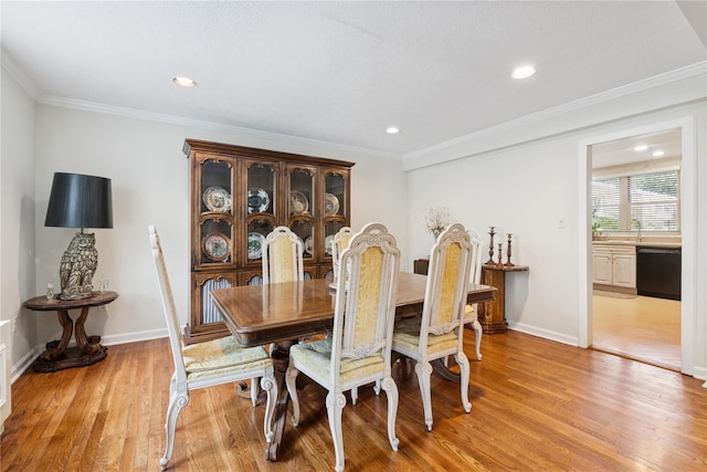 1390 Broadway Unit 118, Hewlett, NY 11557 - dining area featuring light wood-style flooring, recessed lighting, and crown molding