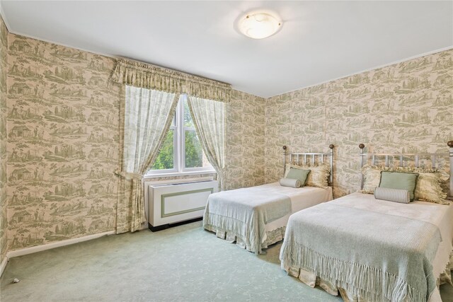 1390 Broadway Unit 118, Hewlett, NY 11557 - carpeted bedroom featuring wallpapered walls and ornamental molding