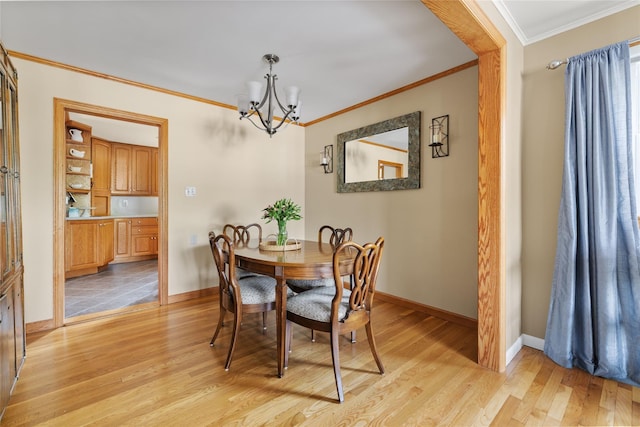 37 Rutland St, Mount Kisco, NY 10549 - dining room featuring a chandelier, ornamental molding, and light wood finished floors