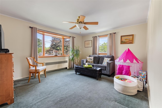 37 Rutland St, Mount Kisco, NY 10549 - carpeted living area featuring radiator, ceiling fan, and ornamental molding