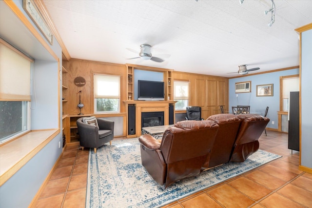 100 Virginia St, Valley Stream, NY 11580 - living room with ceiling fan, healthy amount of natural light, a glass covered fireplace, crown molding, and wooden walls