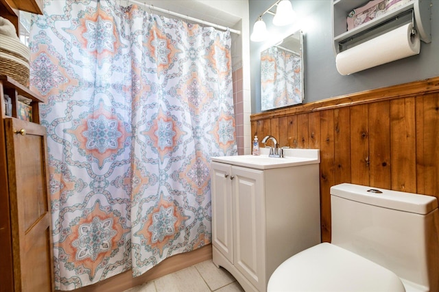 100 Virginia St, Valley Stream, NY 11580 - full bath with vanity, wainscoting, wooden walls, curtained shower, and tile patterned floors