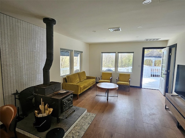 470 Shaver Hill Rd, Andes, NY 13731 - living area featuring a wood stove, hardwood / wood-style flooring, recessed lighting, and baseboards