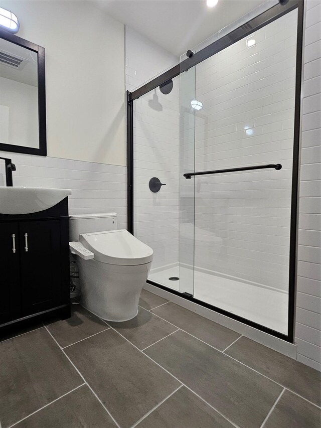 470 Shaver Hill Rd, Andes, NY 13731 - bathroom featuring toilet, vanity, a shower stall, tile patterned flooring, and wainscoting