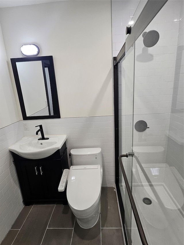 470 Shaver Hill Rd, Andes, NY 13731 - full bath with tile walls, vanity, a shower stall, toilet, and wainscoting