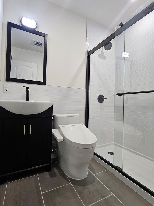 470 Shaver Hill Rd, Andes, NY 13731 - full bathroom featuring vanity, a stall shower, toilet, tile patterned flooring, and tile walls