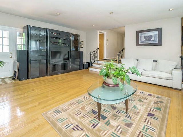 44 Glenwood Rd, Glen Head, NY 11545 - living area featuring wood finished floors, stairway, and recessed lighting