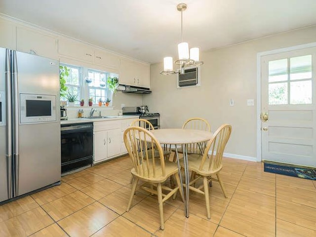 44 Glenwood Rd, Glen Head, NY 11545 - dining area featuring a chandelier, light tile patterned flooring, and baseboards