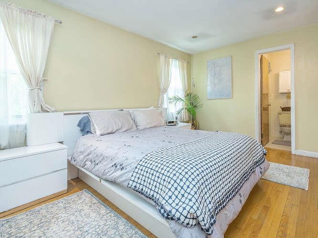 44 Glenwood Rd, Glen Head, NY 11545 - bedroom featuring recessed lighting, wood finished floors, baseboards, and connected bathroom