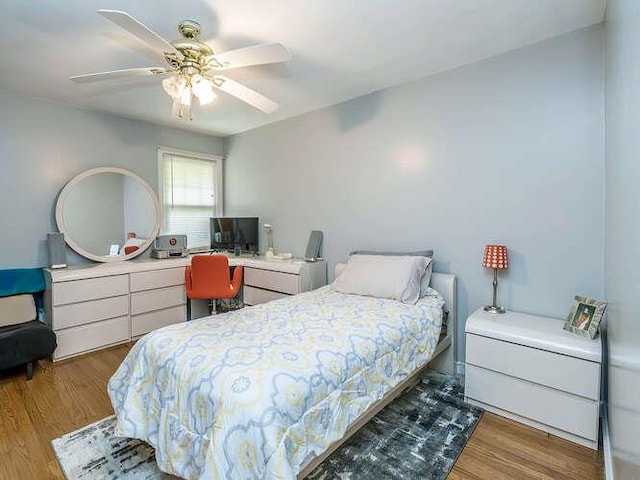 44 Glenwood Rd, Glen Head, NY 11545 - bedroom featuring wood finished floors, ceiling fan, and a desk