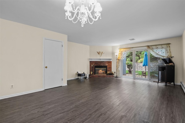 14 Bleakley Dr Unit 14, Peekskill, NY 10566 - unfurnished living room with wood finished floors, a chandelier, and a fireplace