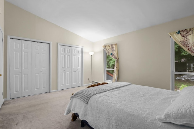 14 Bleakley Dr Unit 14, Peekskill, NY 10566 - bedroom with multiple closets, lofted ceiling, and carpet flooring