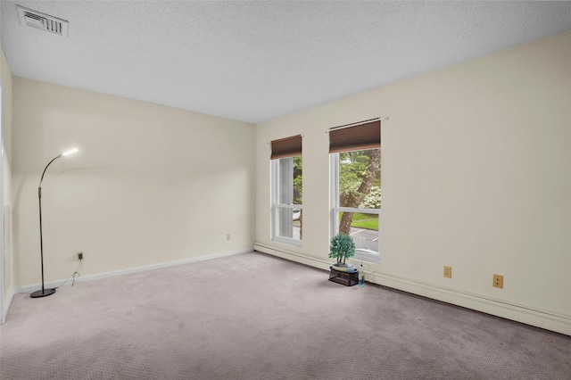 14 Bleakley Dr Unit 14, Peekskill, NY 10566 - carpeted empty room featuring baseboard heating and a textured ceiling