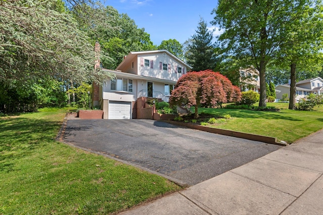 29 Ravenwood Dr, Kings Park, NY 11754 - view of front of house with driveway, a front yard, and a garage