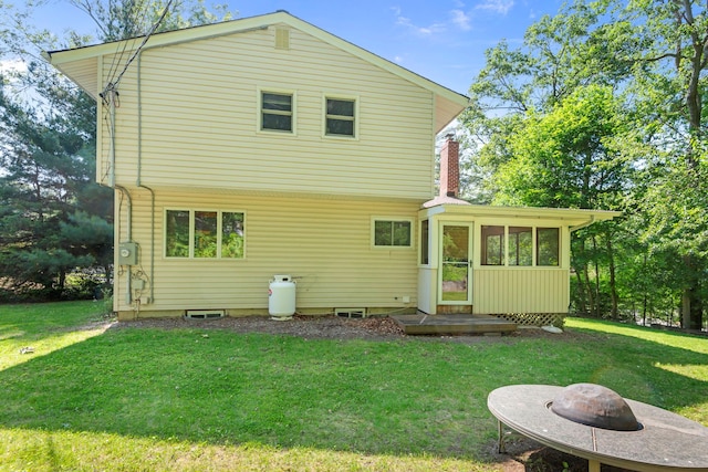 29 Ravenwood Dr, Kings Park, NY 11754 - back of house with a sunroom and a lawn