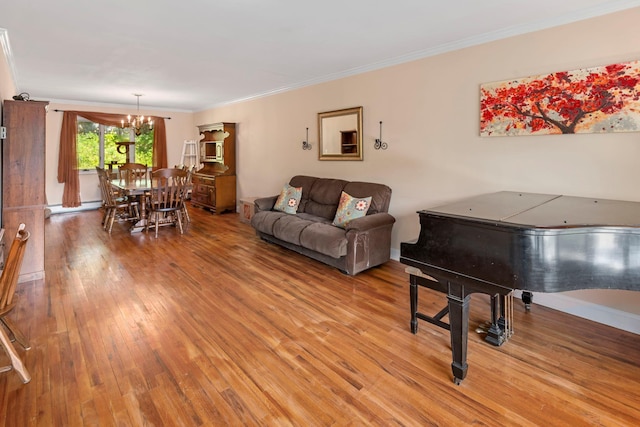 29 Ravenwood Dr, Kings Park, NY 11754 - living area with a chandelier, a baseboard heating unit, ornamental molding, and light wood-type flooring