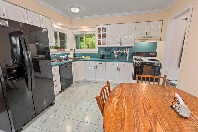 29 Ravenwood Dr, Kings Park, NY 11754 - kitchen with black appliances, under cabinet range hood, a sink, ornamental molding, and white cabinetry