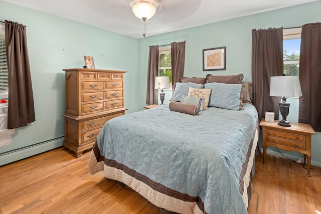 29 Ravenwood Dr, Kings Park, NY 11754 - bedroom with light wood finished floors and ceiling fan