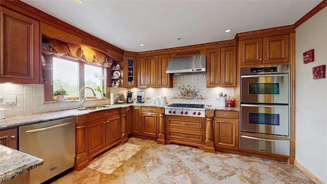 81 Avondale Rd, Yonkers, NY 10710 - kitchen with stainless steel appliances, a warming drawer, wall chimney exhaust hood, brown cabinetry, and recessed lighting