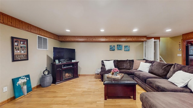 81 Avondale Rd, Yonkers, NY 10710 - living room featuring light wood finished floors, recessed lighting, and stairs