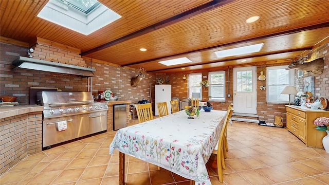 81 Avondale Rd, Yonkers, NY 10710 - dining room featuring a skylight, brick wall, wooden ceiling, and light tile patterned floors