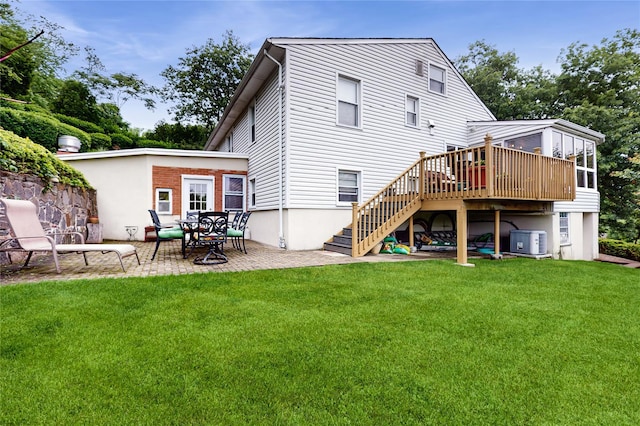 81 Avondale Rd, Yonkers, NY 10710 - rear view of property featuring stairway, a lawn, a patio area, and a wooden deck
