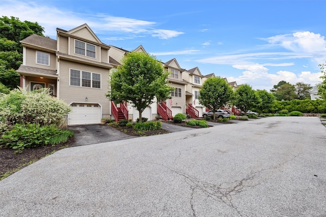 28 Winhaven Ct Unit 20, Highland Falls, NY 10928 - view of property featuring stairs, driveway, a garage, and a residential view