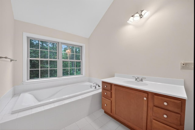 28 Winhaven Ct Unit 20, Highland Falls, NY 10928 - bathroom featuring a garden tub, vanity, vaulted ceiling, and tile patterned floors