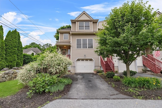 28 Winhaven Ct Unit 20, Highland Falls, NY 10928 - view of front of house featuring stairway, asphalt driveway, and an attached garage