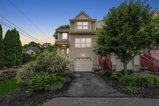 28 Winhaven Ct Unit 20, Highland Falls, NY 10928 - view of front of property featuring stairway, asphalt driveway, and a garage