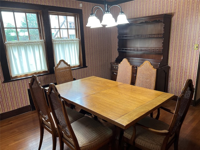 8 Alexine Ave, East Rockaway, NY 11518 - dining area with wallpapered walls, hardwood / wood-style floors, a chandelier, and baseboards