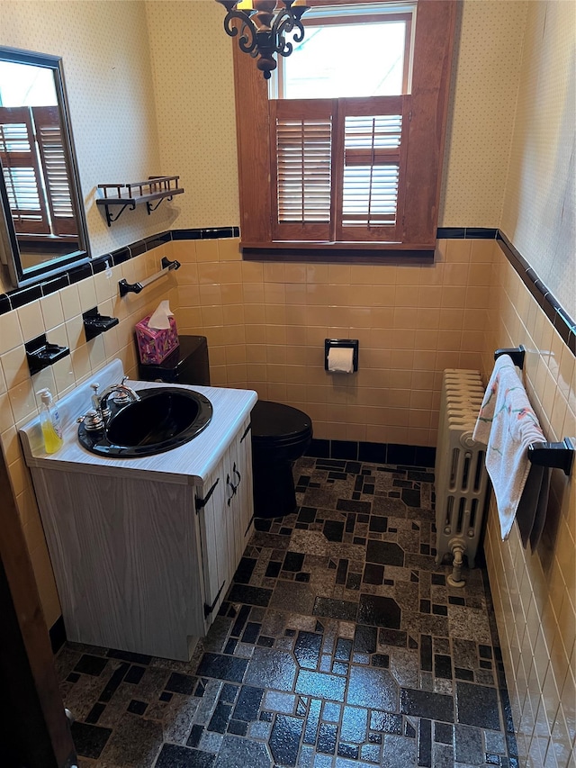 8 Alexine Ave, East Rockaway, NY 11518 - bathroom with wallpapered walls, tile walls, vanity, a wainscoted wall, and toilet