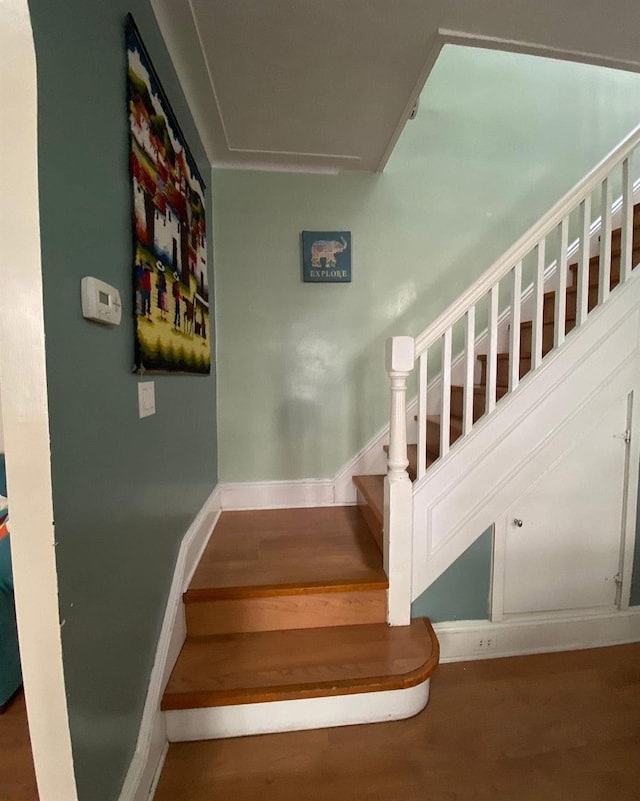 6910 68th St, Glendale, NY 11385 - staircase featuring wood finished floors and baseboards