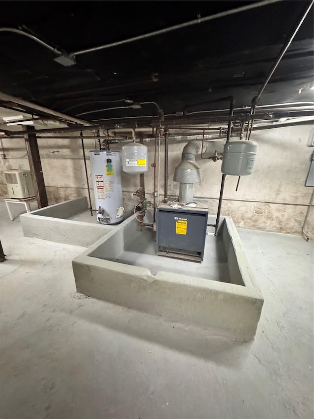 21 Jefferson St, Brooklyn, NY 11206 - unfinished basement featuring water heater