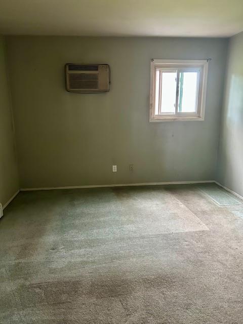25 Waldron Dr, Stony Point, NY 10980 - carpeted empty room featuring a wall unit AC and baseboards