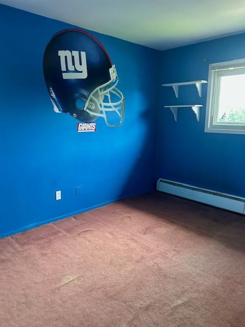 25 Waldron Dr, Stony Point, NY 10980 - unfurnished room featuring baseboard heating and carpet floors