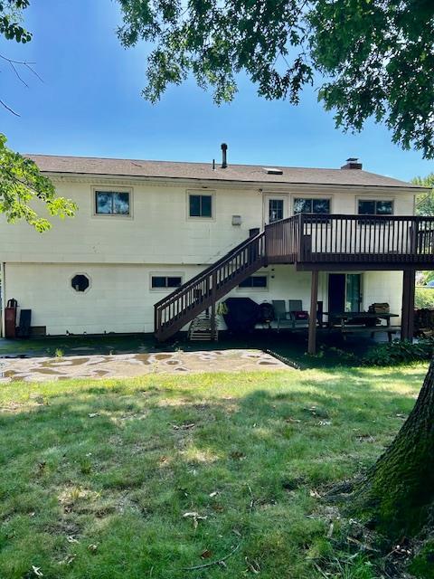 25 Waldron Dr, Stony Point, NY 10980 - rear view of house featuring stairs, a deck, and a lawn