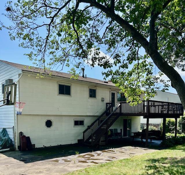 25 Waldron Dr, Stony Point, NY 10980 - rear view of property featuring stairs, a wooden deck, and a patio