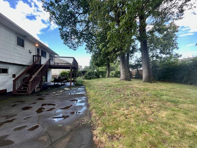 25 Waldron Dr, Stony Point, NY 10980 - view of grassy yard featuring stairs and a wooden deck