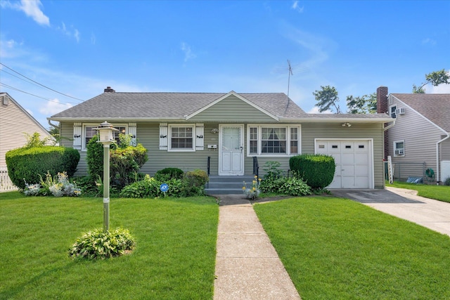 475 Emerson St, Uniondale, NY 11553 - view of front of home featuring an attached garage, concrete driveway, a front yard, and a shingled roof