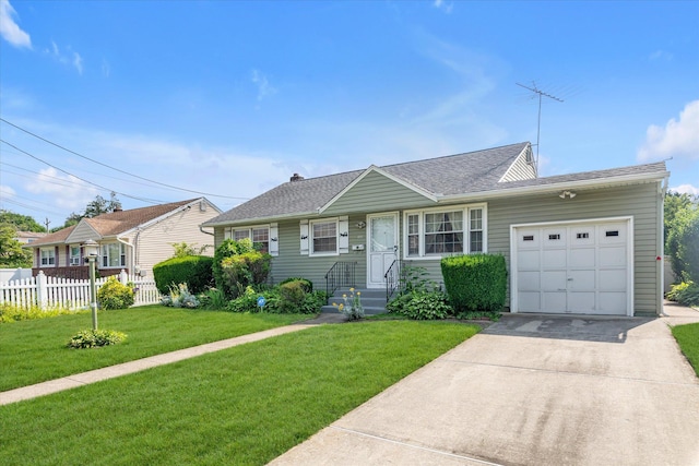 475 Emerson St, Uniondale, NY 11553 - view of front of home featuring an attached garage, concrete driveway, and a shingled roof