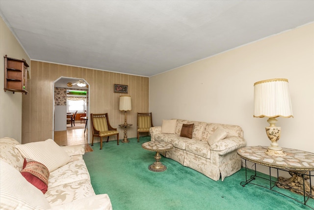 475 Emerson St, Uniondale, NY 11553 - living room with arched walkways, carpet, and ornamental molding