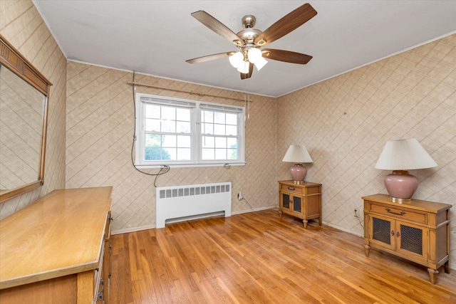 475 Emerson St, Uniondale, NY 11553 - sitting room with radiator, light wood-style floors, a ceiling fan, and crown molding