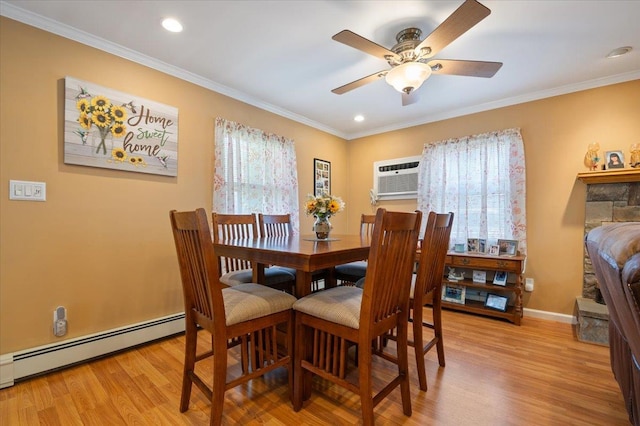 37 Swan Ln, Levittown, NY 11756 - dining room featuring a baseboard heating unit, light wood finished floors, a ceiling fan, crown molding, and recessed lighting