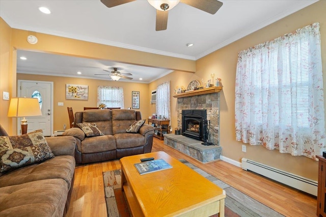 37 Swan Ln, Levittown, NY 11756 - living room with a baseboard radiator, a ceiling fan, light wood-type flooring, recessed lighting, and crown molding