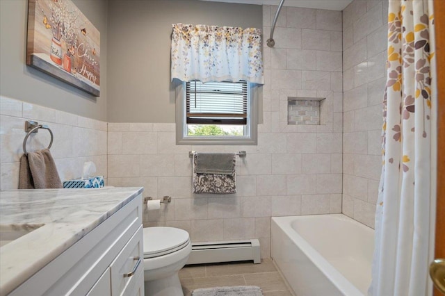 37 Swan Ln, Levittown, NY 11756 - full bathroom featuring a baseboard radiator, vanity, tile patterned floors, tile walls, and shower / bathtub combination with curtain
